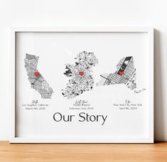 a white framed print with the words our story and two red hearts on it's map