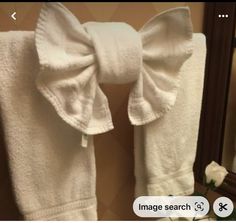 there is a white robe with a bow on it