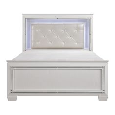 an upholstered white bed frame with buttons