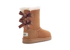 We added sweet silky bows to your little one's favorite boot, but kept the super-soft sheepskin feel they love. Built to move the way kids do, each boot features a rocker-bottom shape for a barefoot feel and our super-lightweight outsole for traction and durability.This product was made in a factory that supports women in our supply chain with the help of HERproject, a collaborative initiative that creates partnerships with brands like ours to empower and educate women in the workplace. | Protec Women In The Workplace, Ugg Bailey Bow, Ugg Store, Pink Azaleas, Bailey Bow Uggs, Bow Boots, Ugg Bailey, Bailey Bow, Kids Uggs