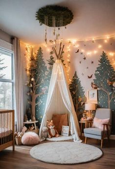 a baby's room decorated with christmas lights and trees