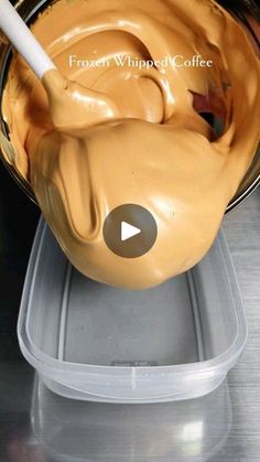 a bowl filled with peanut butter sitting on top of a counter