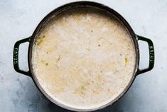 a pot filled with soup sitting on top of a table