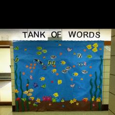 a bulletin board that says tank of words with fish and seaweed in the water