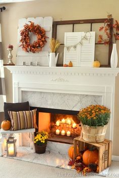 a living room filled with furniture and a fire place covered in pumpkins next to a window