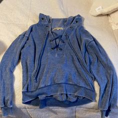 Very Soft Hoodie Never Worn, Looks Denim Material Has A Cross Tie In The Front Medium Wash Long Sleeve Casual Hoodie, Casual Medium Wash Long Sleeve Hoodie, Denim Blue Hooded Hoodie For Fall, Denim Blue Cotton Hoodie For Fall, Denim Blue Long Sleeve Hoodie For Spring, Casual Denim Blue Hoodie For Fall, Long Sleeve Denim Blue Hoodie For Spring, Cotton Hoodie For Spring, Casual Denim Blue Hooded Hoodie