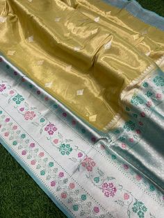 This is a very beautiful Pure banarasi katan tissue silk handloom saree Kadhyal weave border, Sona Rupa weave booties, golden n silver zari, paithani tilffi border, with  blouse piece.  Saree length - 5.5 mtr. Blouse - 1 mtr.  Dry clean only . Please note - color may be vary a little due to sunlight and photography . Please message us after purchasing in case you want fall and Pico done it not . No extra charges for fall and Pico but inform us . Blouse stitching is also available . Yellow Tussar Silk Dupatta With Border, Tissue Silk Dupatta With Border, Traditional Banarasi Silk Dupatta As Gift, Traditional Banarasi Silk Dupatta For Gift, Traditional Art Silk Saree For Gift, Diwali Gift Saree, Yellow Tussar Silk Saree With Border, Banarasi Silk Saree With Zari Weaving As Gift, Yellow Katan Silk Saree With Border