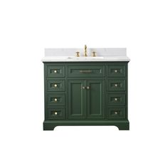 a green vanity with two sinks and gold faucets