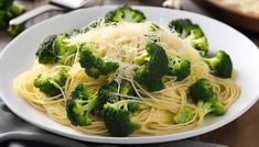 pasta with broccoli and parmesan cheese in a white bowl on a wooden table