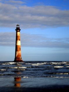 a light house sitting on top of the ocean