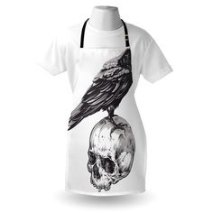 a white apron with a black crow on top of it and a skull in the middle