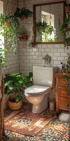 a bathroom with potted plants on the wall and a toilet in the middle, next to a window