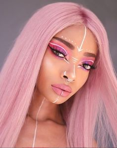 a woman with pink hair and makeup has white lines painted on her face as she poses for the camera