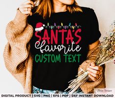 a woman wearing a santa's favorite custom text t - shirt is holding flowers