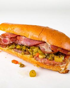 a sandwich with meat and vegetables on it