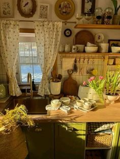 a kitchen filled with lots of pots and pans