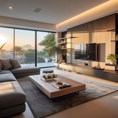 a living room with couches, coffee table and large windows looking out onto the city