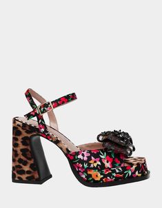 Step into a whole new world of playful style with the LILIE BLACK DITSY FLORAL sandal. This heeled sandal features a unique combination of leopard and floral prints, making it the perfect statement piece for any outfit. Let your wild side shine through with this fun and flirty shoe! Synthetic upper material with textil Leopard Print Sandals With Round Toe For Party, Chic Sandals With Floral Print And Open Heel, Open Toe Sandals With Floral Print For Evening, Chic Floral Print Sandals With Open Heel, Floral Print Open Toe Sandals For Evening, Chic Floral Print Open Heel Sandals, Evening Floral Print Open Toe Sandals, Leopard Print Open Heel Sandals For Party, Party Sandals With Floral Print In Synthetic Material