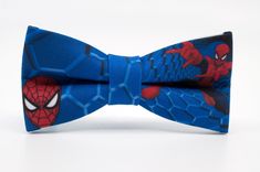 a blue bow tie with spiderman on it