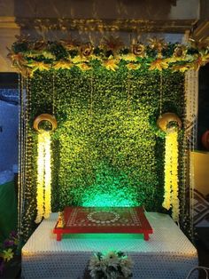 a wedding stage decorated with flowers and greenery