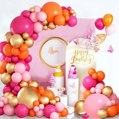 a pink and gold birthday party with balloons, confetti, cake and decorations