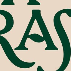 the letters are in green and black on a beige background that says racq