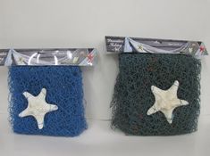 two blue and green net bags with white starfishs on the sides, one is empty