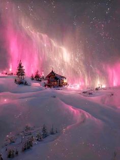 the night sky is lit up with pink lights and stars above snow covered hills, houses and trees