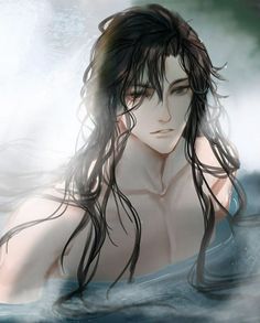 a man with long hair swimming in the water