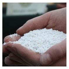 a person holding some white powder in their hands