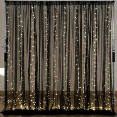 a curtain with lights hanging from it's side