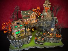 an assortment of halloween themed houses on display