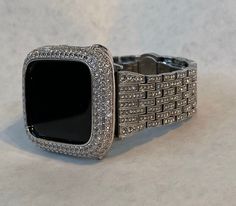 Fits the Apple Watch available for sizes 38mm 40mm 41mm 42mm 44mm 45mm 49mm Ultra 1 or 2 in series 1,2,3,4,5,6,7,8,9 or SE Men's & Women's. Silver Apple Watch Band set with High End Swarovski Crystals in a Stainless Steel Bandy with a butterfly buckle. Wrist size fits 5.75 inch to 8.5 inch, comes with tool and instructions for resizing. Durable and elegant stainless steel. Comes with a link removal tool and instructions. Add a Silver Apple Watch Cover Custom Silver 14k White Gold Plated Metal lab Diamond Bezel style with micro pave lab diamonds. Two bars on the back hold the watch firmly in place, easy to get on and off. Access to all button. There is no screen protector. PLEASE NOTE THAT THIS LISTING HAS MULTIPLE PURCHASING OPTIONS UPON CHECKOUT **Apple Watch is not include used for photo Apple Watch Cover, Apple Watch Band Women, Candy Watch, Crystal Apple, Silver Apple, Apple Watch Bands Women, Iphone Watch, Apple Watch Case, Apple Watch Accessories