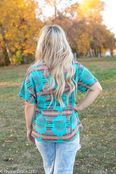 Classic tee gets a little western in this casual beauty! In shades of turquoise and red, this pretty number is perfect for layering or a simple any day tee. 100% Polyester Short Sleeve T-shirt For Vacation In Fall, Fall Vacation T-shirt With Short Sleeves, Casual Turquoise Cotton Blouse, Casual Turquoise Short Sleeve Blouse, Turquoise Short Sleeve Top For Summer, Turquoise Short Sleeve Tops For Spring, Turquoise Casual Summer Tops, Turquoise Relaxed Fit Short Sleeve Top, Casual Turquoise Tops For Summer