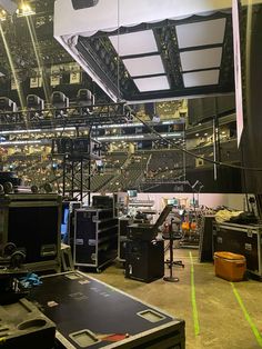 a large room with lots of equipment and lights on the ceiling in front of it