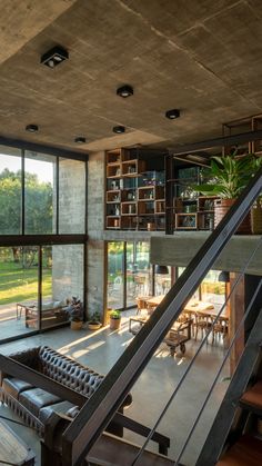 a living room filled with furniture and lots of windows