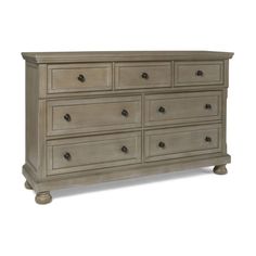 a large dresser with many drawers and knobs on the bottom drawer, in an antique style