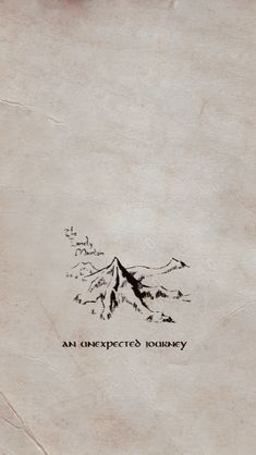 an old book with writing on it that says an unexpected journey and mountains in the background