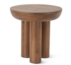 two wooden stools sitting next to each other