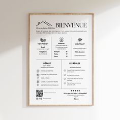 a white poster hanging on the wall next to a wooden framed sign that says benvenue