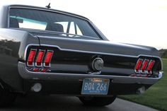 the rear end of an old black car