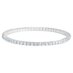 Iconic and stylish, this flexible diamond bangle bracelet is designed to make a statement. Crafted from 18K White, Yellow, or Rose Gold, with round brilliant cut diamonds, it effortlessly complements any outfit. Whether worn alone or stacked, it exudes elegance and sophistication. This single bangle features Approximately 5.5 Carats of Round brilliant diamonds set in 18k WhiteGold. Perfect for stacking with similar styles or wearing on its own, it adds a touch of luxury to any ensemble. Each ban Tennis Bracelet Diamond 1stdibs, Exquisite Diamond-cut White Gold Bracelets, Adjustable White Diamond Bracelet, Fine Jewelry, Luxury Yellow Gold Tennis Bracelet, Fine Jewelry, Single Bangle, 14k Gold Link Diamond Bracelet, Tarnish Resistant, Diamond Bangle Bracelet, Diamond Bangles Bracelet, Diamond Bangle