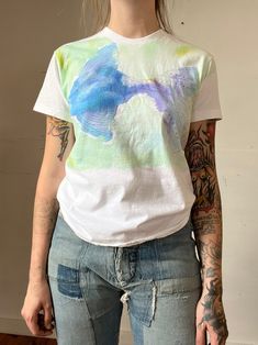 "Vintage water color fish T-shirt. Good vintage condition.  Measurements flat:  19\" Pit to Pit  22\" Length  All sales final, please ask any questions before buying! Thank you!" Spring Crew Neck T-shirt With Paint Splatter, Summer Short Sleeve T-shirt With Paint Splatter, Multicolor Crew Neck T-shirt With Paint Splatter, Multicolor Paint Splatter Crew Neck T-shirt, White Short Sleeve T-shirt With Paint Splatter, Multicolor Rainbow Print Short Sleeve T-shirt, Rainbow Print Short Sleeve T-shirt, White Watercolor Print Short Sleeve T-shirt, White Relaxed Fit T-shirt With Watercolor Print