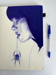 a drawing of a woman with a spider hanging from her mouth next to a marker pen