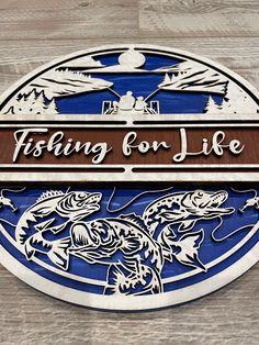 a sign for fishing for life on a wooden surface