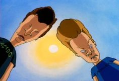 two men are looking at each other in front of the sun and blue sky, one has his mouth open