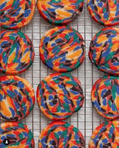 colorful cookies are on a cooling rack ready to be baked in the oven or eaten