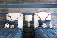 two twin beds with baseball themed headboards