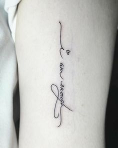 a woman's arm with a tattoo on it that says, love and strength