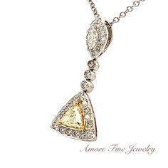 This Natural Yellow & White Diamond Necklace by Cherie Dori Has 30 Round Brilliant Cut Diamonds Weighing .35 Carat Total All With "G" Colors and VS2 Clarity's, 1 Natural Yellow Trillion shape Diamond Weighing .35 Carat With a VS2 Clarity and 1 Marquise Shape Diamond Weighing .10 Carat With a "G" Color and SI1 Clarity. Setting is 18kt White Gold Weighing 1.9 grams Measuring 27.5 mm long by 11.0 mm wide on a 18kt White Gold 2.0 gram 16" Rolo Chain. Gia Certified Pendant Necklace For Formal Occasions, Yellow Gold Gia Certified Necklace For Wedding, Gia Certified Yellow Gold Necklace For Wedding, Gia Certified Platinum Necklaces For Weddings, Gia Certified Pendant Necklaces For Anniversary, Gia Certified Pendant Necklace For Anniversary, Gia Certified Diamond Necklace For Wedding, Gia Certified Diamond White Necklaces For Wedding, Wedding Pendant Necklace Gia Certified